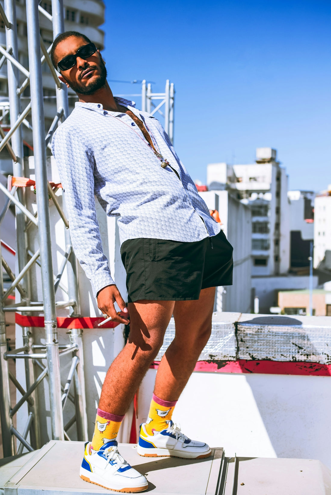 a man standing on top of a metal structure